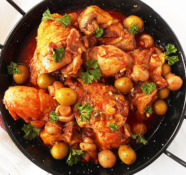 Chicken Cacciatore  (Pollo alla Cacciatora) is Hunter’s chicken stew, rustic Italian classic with chicken thighs and drumsticks, mushrooms, and olives simmered in red wine to get rustic sauce served with your favorite pasta! Authentic stovetop version.