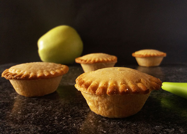 Mini Apple Pies are individual pies loaded with Granny Smith apple filling, cinnamon, and brown sugar wrapped in ready to use pie crust. Harvest time perfect bites to serve with vanilla ice cream!