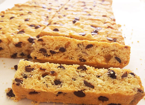 Chewy Chocolate Chip Hazelnut Cookie Bars are rich in flavour, easy to make, cut to bars and perfect to dip into glass of milk. Ready in 30 minutes.