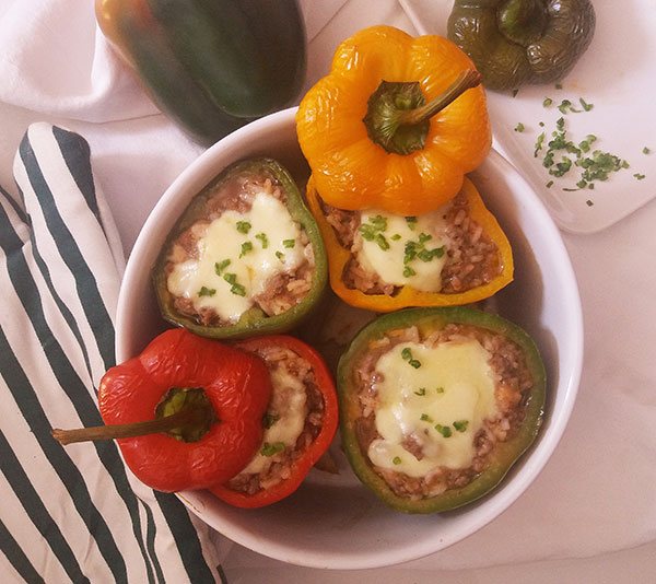 Old Fashioned Stuffed Bell Peppers Recipe is summertime classic. It is easy, frugal, and tasty stuffed bell pepper recipe with ground beef and precooked rice, topped with mozzarella!