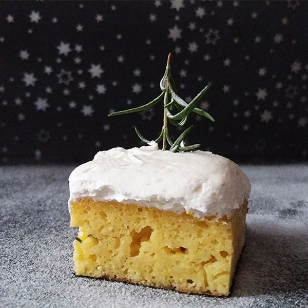 Ricotta Rosemary Cake with Mascarpone Icing; great reminder of snowy landscape, served on a plate : light, moist, tasty and fragrant dessert with lemons and fresh rosemary.