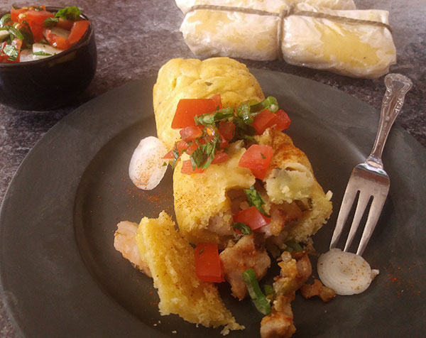 Tamales from Scratch : wrapped in baking paper instead of corn husk, easy to prepare in your stove top steamer, filled with pork and served with Pico de Galo.