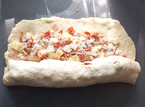 Tortano Bread from Scratch is Italian Easter bread filled with eggs, spicy salami, ham, cheese and pork crackings. Perfect brunch or outdoor picnic snack.