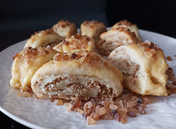 Easy Rugelach Recipe gives you simple hazelnut version with cottage cheese. Small slices of flaky crust instead of rolled wedges are so attractive to enjoy for holidays. Delicious and simple to make perfectly sweet rugelach cookies is your new must do recipe!