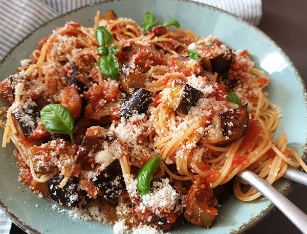 Pasta alla Norma (Eggplant Pasta) is easy traditional Sicilian pasta dish loaded with tomato sauce and fried eggplant. Garnished with grated parmesan and fresh basil, it is vegetarian, easy to prepare comforting pasta dish!