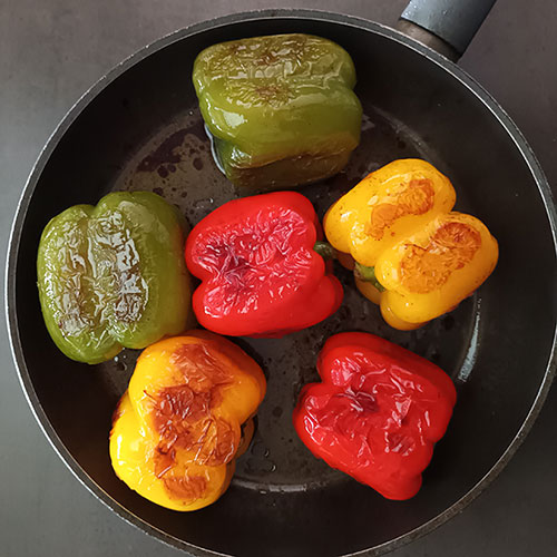 Roasted Pepper Salad is colourful and healthy roasted bell pepper salad with garlic and extra virgin olive oil. Roasted on the stove top, it can be enjoyed all year round!
