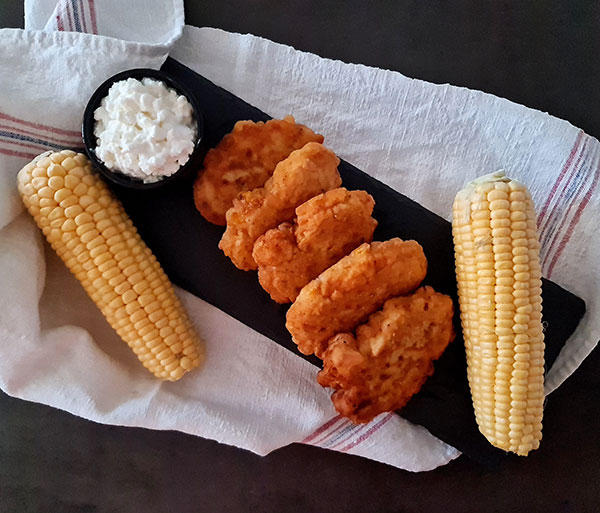 Sweetcorn Fritters contain sweetcorn kernels mixed into a simple batter and fried until crisp. Fifteen minutes to have great summer lunch or dinner. Sweetcorn Fritters contain sweetcorn kernels mixed into a simple batter and fried until crisp. Fifteen minutes to have great summer lunch or dinner.