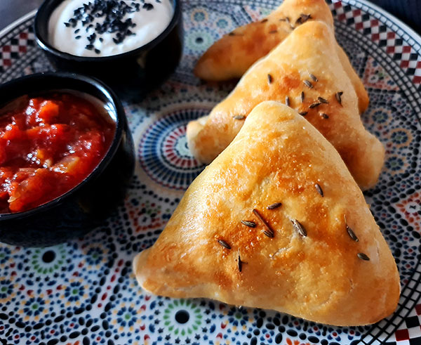 Uzbek Somsa from Scratch is satisfying street food made with mutton or beef. I used rotisserie chicken leftovers. Uzbek Somsa from Scratch is satisfying street food made with mutton or beef. I used rotisserie chicken leftovers.